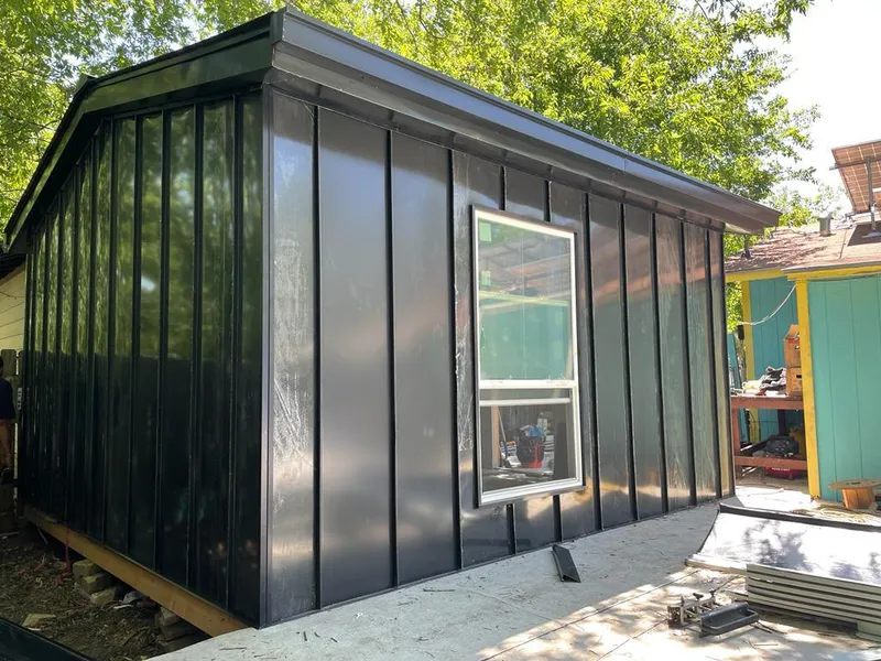 Black standing seam metal wall panels for Roof Inspection in Fife